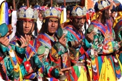 The new King was greeted by dancers and colorfully dressed people